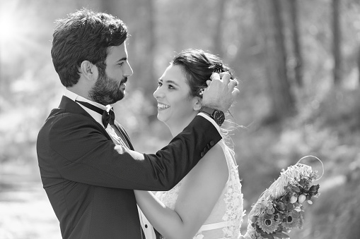 Walk of love in the nature. Wedding couple in a forest. Black and White photography.