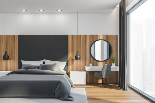 istock Wooden white bedroom interior with bed and dressing table near window 1332007433