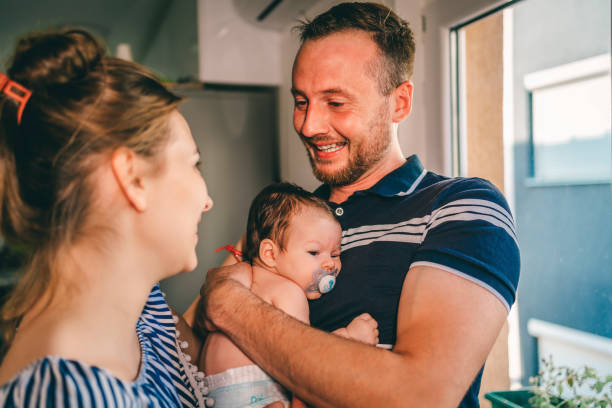 istock Young parents and cute baby 1332008630