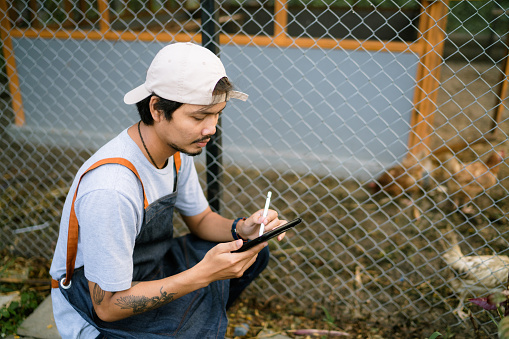 Asian gardeners practice using tablets for comfort and modernity in their gardens.