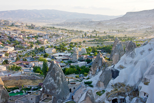 Sunrise view of Love valley Goreme Cappadocia. There are many tourist watching hot air balloons which are traditional touristic attraction in Cappadocia.