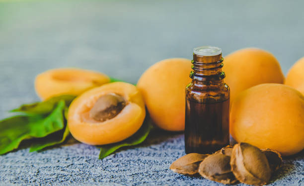 istock Apricot kernel oil in a small bottle. Selective focus. 1332010194
