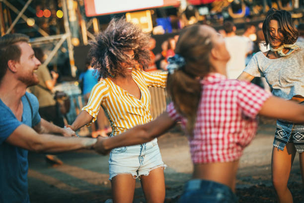 istock Group of friends dancing at a concert. 1332010989