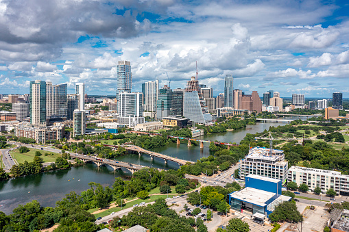 Austin, United States – June 10, 2023: An aerial view of downtown Austin with modern buildings along the riverbank. Texas, USA