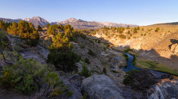 istock Sunrise over Hot Creek Geological site in California 1332017472
