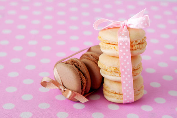 Macaroni cakes with vanilla and chocolate filling close-up. Gourmet dessert