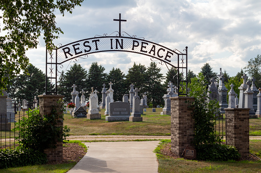 New Trier, Minnesota - August 1, 2021: Cemetery of St. Mary’s Catholic church, built in 1090 and settled by German immigrants from Trier and Luxembourg area. Listed on the National Register of Historic Places.