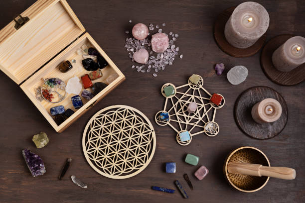 istock Healing chakra crystal grid therapy. Rituals with gemstones and aromatherapy for wellness, healing, meditation 1332033391