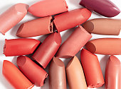 Various cut lipsticks on white background. Makeup product samples