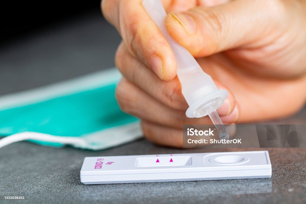 Drop nasal sample into rapid antigen test stick. Drop nasal sample into rapid antigen test stick.PCR rantigen test for check coronavirus.Quick anlayze virus.Swab fast for check covid-19. Rapid Antigen Test Stock Photo