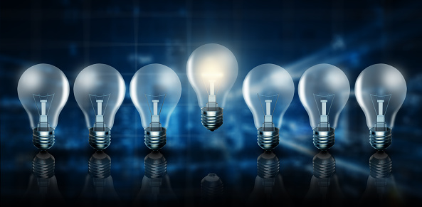 Illuminated light bulb in a row. One different glowing blue abstract background. Business bright idea, Great idea, Innovation, Creativity, Solution, and imagination Concept. 3D Rendering.