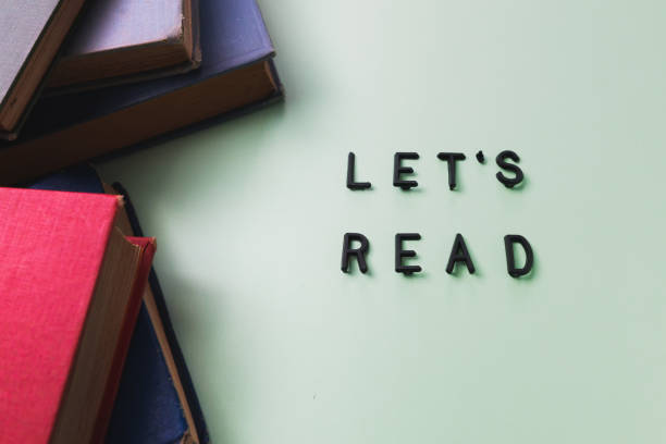 istock Old books over a pale green backdrop. Copy space. 1332049500