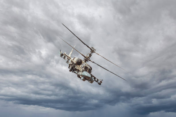 istock Military helicopter in the sky 1332066574