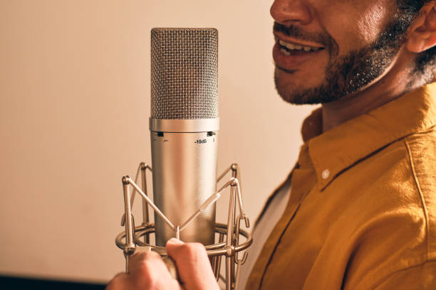 istock Bearded man recording vocals in studio 1332068690