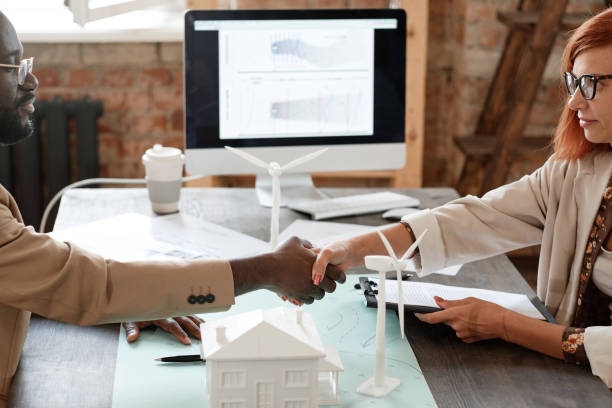 istock Business partners shaking hands at meeting 1332068798