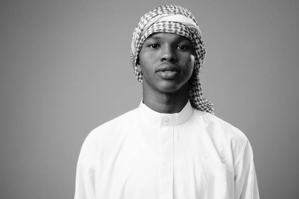 istock Young African man wearing traditional Muslim clothes 1332068947
