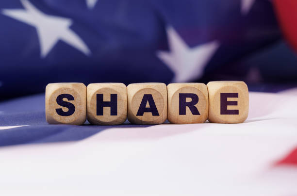 istock The US flag has cubes with the inscription - SHARE 1332072163