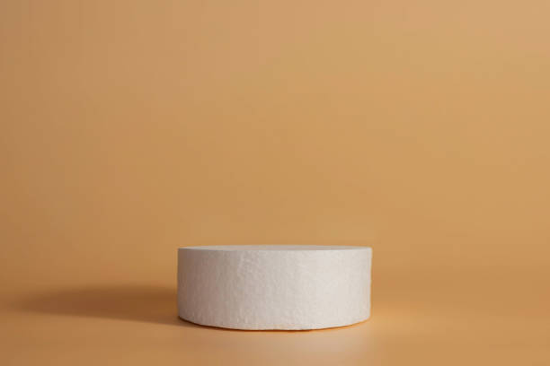 istock Copy space empty white coasters podium on a beige background. Blank unbranded shopfront. Product advertisement. Fashion, beauty, care, trend concept.Scene with Minimal geometrical forms. 1332073172