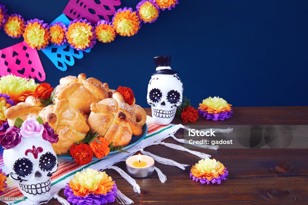 Day of the dead, Dia De Los Muertos Celebration Background Day of the dead, Dia De Los Muertos Celebration Background With sugar Skull, calaverita, marigolds or cempasuchil flowers, bread of death or Pan de Muerto with Copy Space. Traditional Mexican culture Day Of The Dead Stock Photo