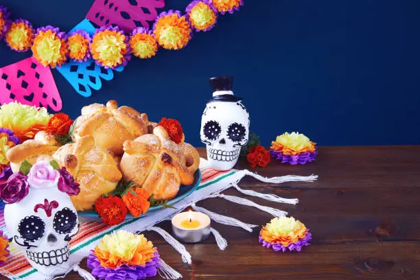 Day of the dead, Dia De Los Muertos Celebration Background With sugar Skull, calaverita, marigolds or cempasuchil flowers, bread of death or Pan de Muerto with Copy Space. Traditional Mexican culture