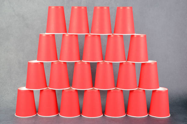 istock Red paper cups arranged in a pyramid in four rows. 1332077426