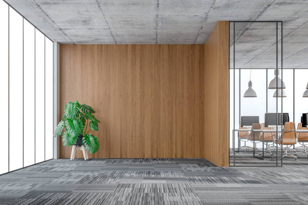 istock Large office interior: a reception desk, a lounge corner with copy space and wordesks behind glass door 1332079230
