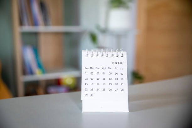 istock Calendar desk place on table. Desktop Calender for Planner to plan agenda, timetable, appointment, organization, management each date, month, and year on wooden office table.Calendar Concept. 1332079376