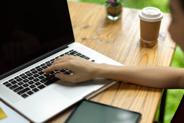 istock Female fingers pressing on laptop keyboard 1332080715