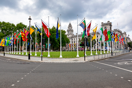 London, United Kingdom - July 27, 2021: A view of  flags installed at Parliament Square in London.