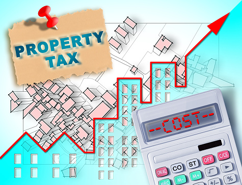 Property Tax and Costs on buildings - Property Real Estate concept with an imaginary cadastral map, residential building and calculator