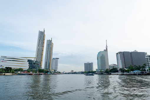 BANGKOK, THAILAND - 24 May 2019 :  high rise buildings located on the river at Chao Phraya river in Bangkok, Thailand