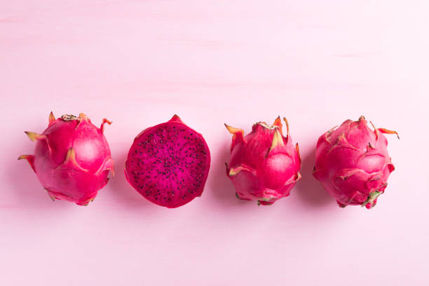 istock Ripe dragon fruit or pitaya on pink background 1332088855