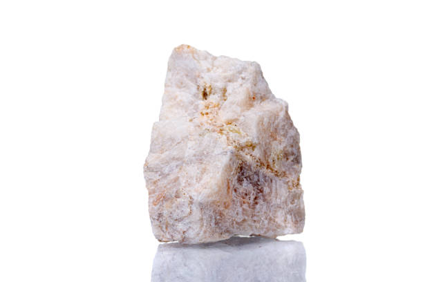 istock macro mineral stone Wollastonite on a white background 1332090328