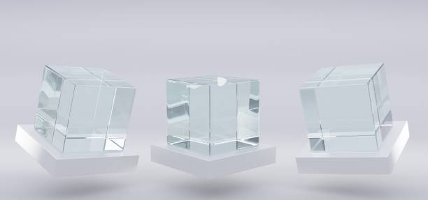 istock Glass or plastic cube on white stand in different angle view. Blank clear square showcase, exhibit podium, crystal block. Mockup of 3d acrylic or plexiglass box for display isolated on grey background 1332091412