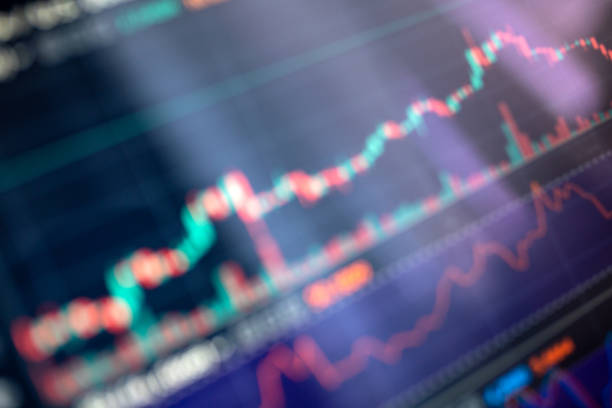 istock Defocused stock exchange charts at digital display background 1332092373