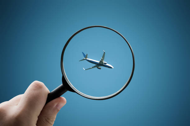 istock Magnifying glass focusing an airplane 1332092391
