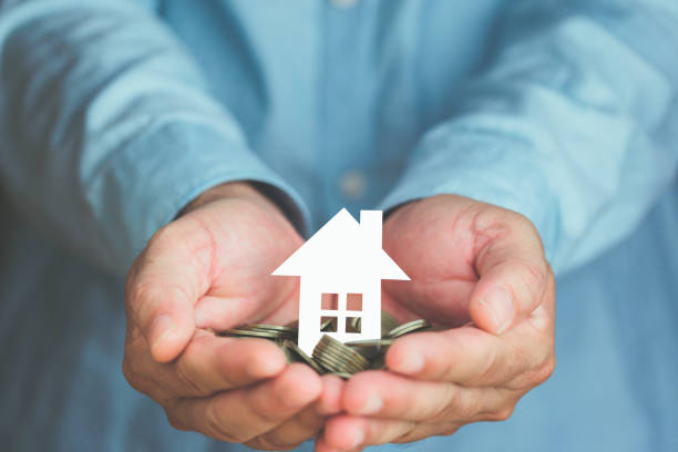 istock paper house in hand concept plan for success 1332092632