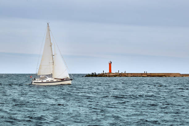 istock Pleasure boat is sailing from harbor to sea 1332092878