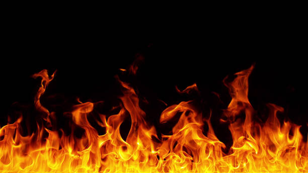 istock Texture of flames isolated on black background. 1332094159