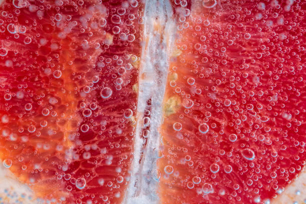 istock Grapefruit close up macro, under water, for juice. Ripe juicy fruit in water 1332095970
