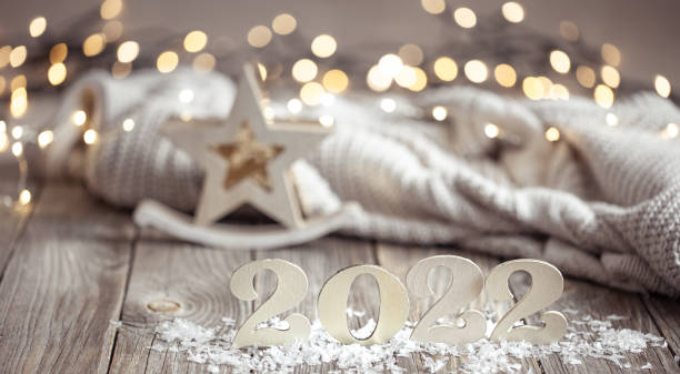 istock Cozy christmas composition with number 2022 and decor details. 1332096027