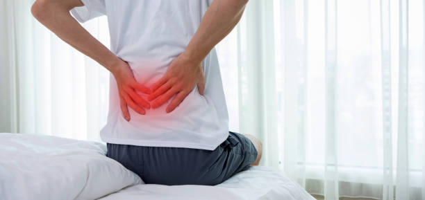 Young man with lower back pain stock photo
