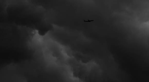 istock An airplane flying in stormy sky 1332097229