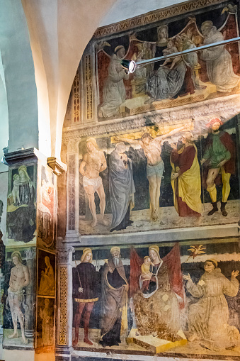 Ancient frescoes on the interior walls of the Church of the Annunciation (Italian: Chiesa di Santa Maria Annunciata), a Catholic church in the town of Bienno. The numerous frescos date back to the sixteenth century with works by Giovanni Pietro da Cemmo and Girolamo Romani, known as Romanino.
