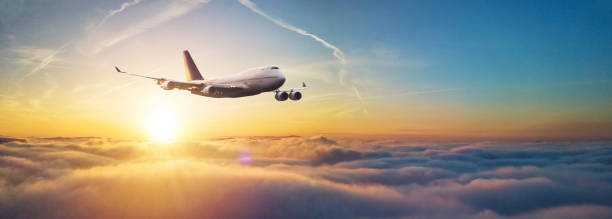 istock Passengers commercial airplane flying above clouds 1332099351