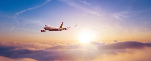 istock Passengers commercial airplane flying above clouds 1332099358