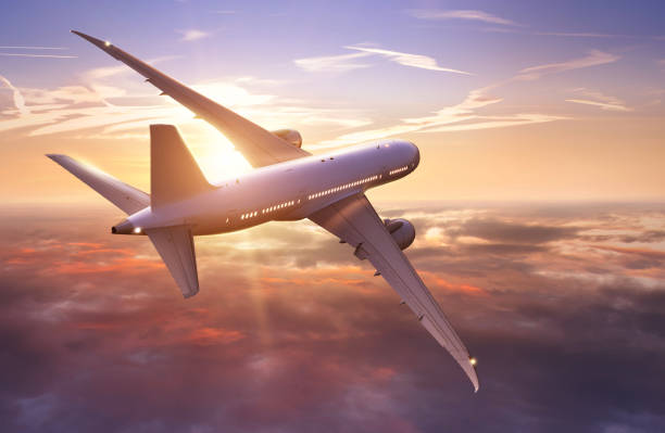 istock Passengers commercial airplane flying above clouds 1332099399