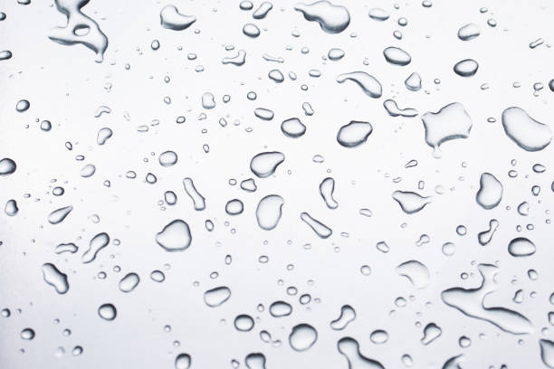 istock Drops of water on a gray background closeup 1332100016