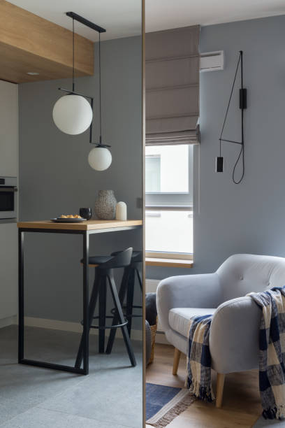 istock Simple kitchen table and armchair in mirror reflection 1332101494