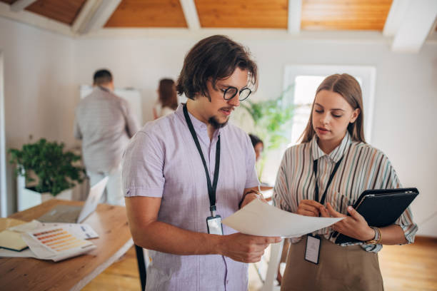 istock Young business people working in modern office 1332102636